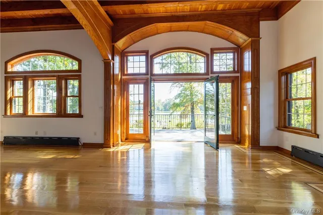a view of an entryway with a floor to ceiling window