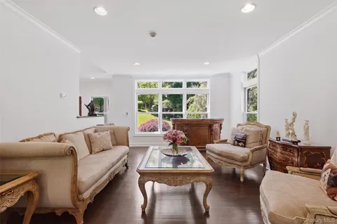 a living room with fireplace furniture and a flat screen tv