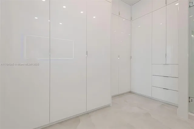 a kitchen with stainless steel appliances a stove a sink and a refrigerator