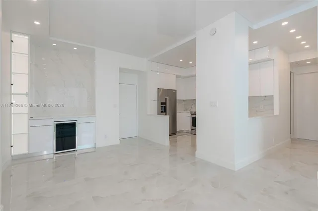 a view of an empty room with a fireplace