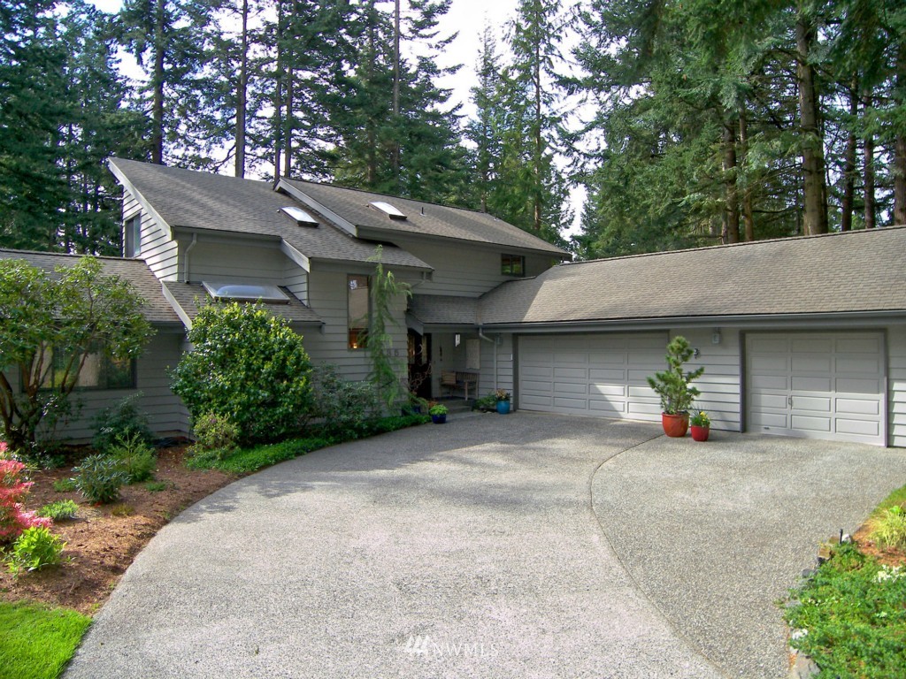 635 Clark Road Bellingham, WA 98225 - Photo 1 of 1 a view of a house with large trees and sitting area