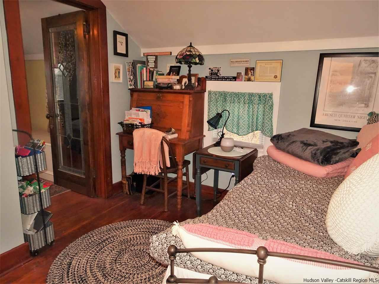 153 Clay Road Ulster Park, NY 12487 - Photo 11 of 25 a living room with furniture and a window
