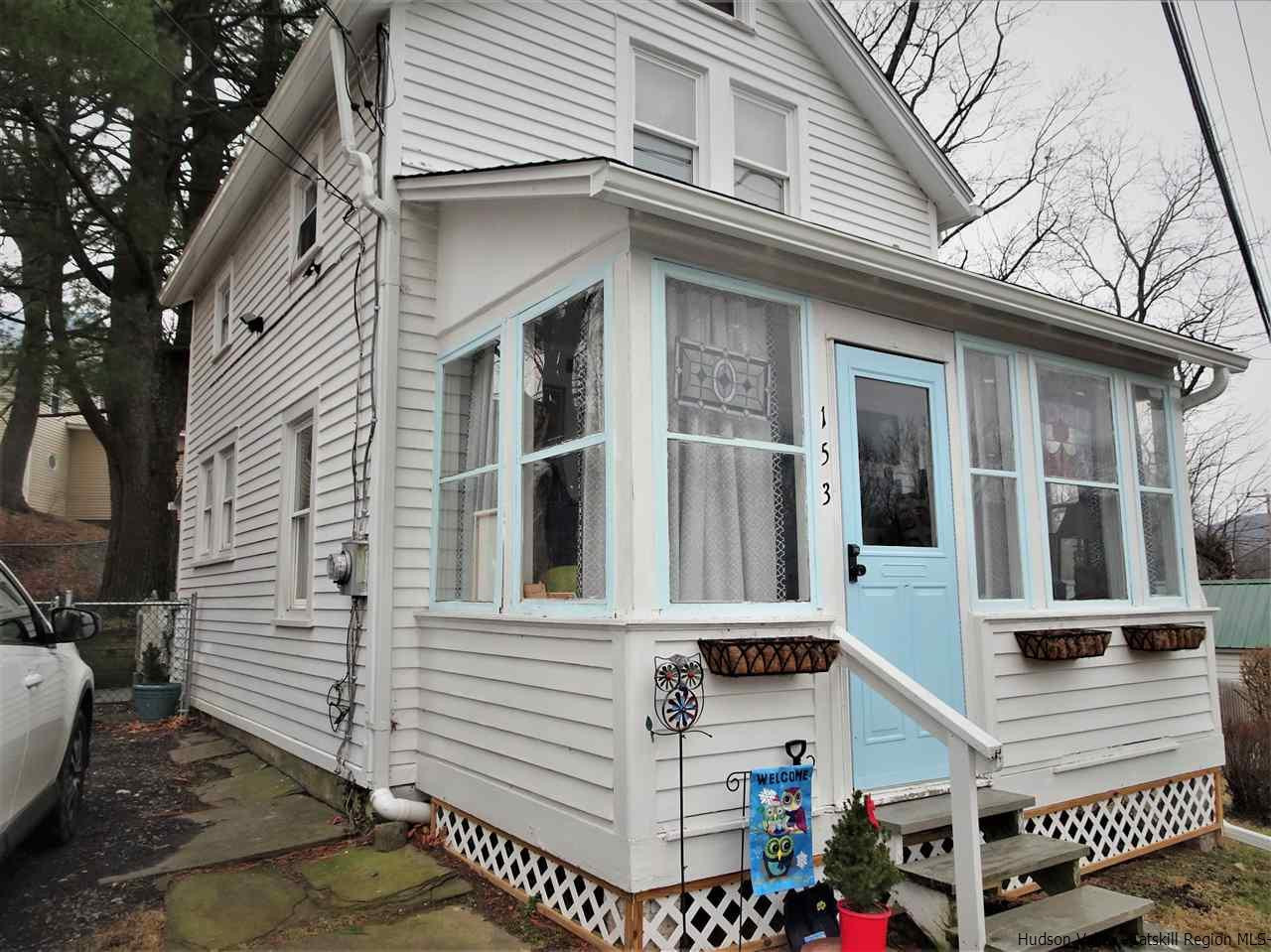 153 Clay Road Ulster Park, NY 12487 - Photo 2 of 25 a view of a white building with many windows
