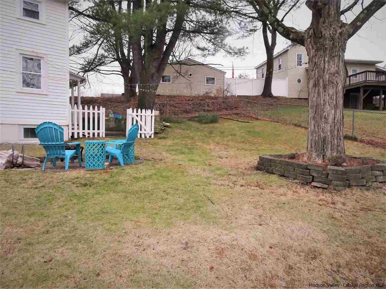 153 Clay Road Ulster Park, NY 12487 - Photo 21 of 25 a view of a yard with an house and wooden fence