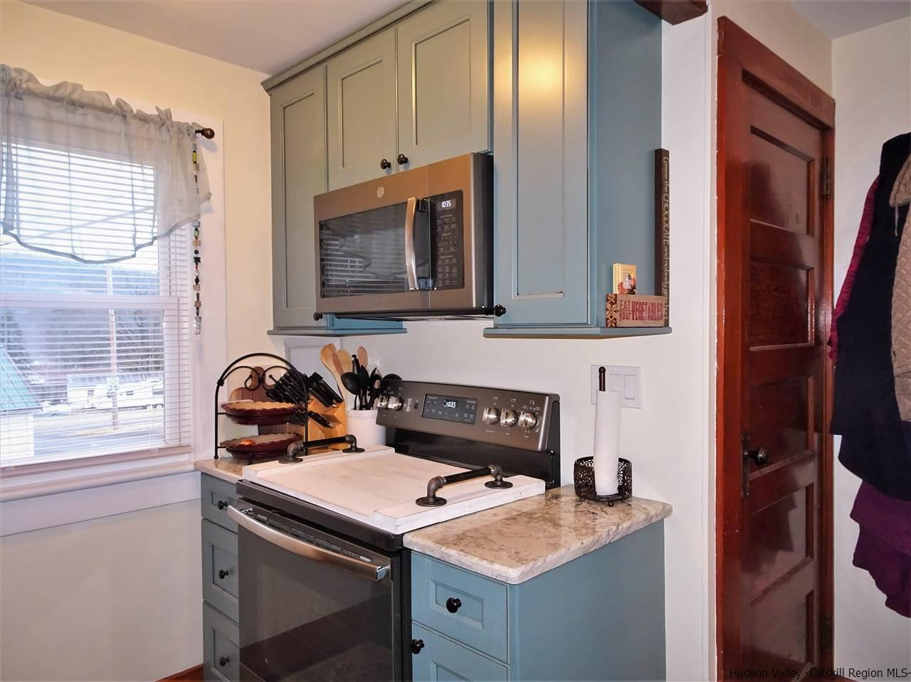 153 Clay Road Ulster Park, NY 12487 - Photo 7 of 25 a bathroom with a stove a sink and a window