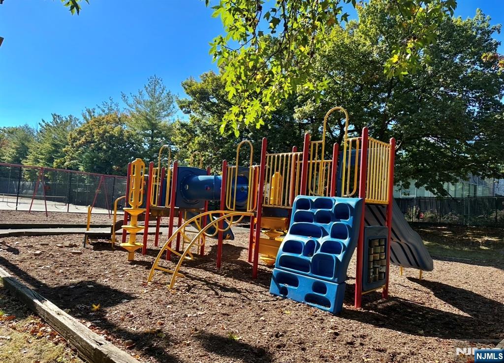 1 Horizon Road, Unit 1025 Fort Lee, NJ 07024 - Photo 12 of 27 a view of a wooden deck with a bench