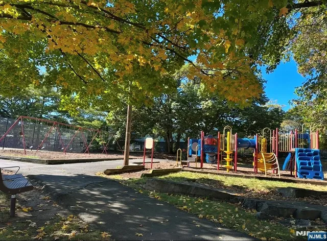 a view of outdoor space with garden and trees