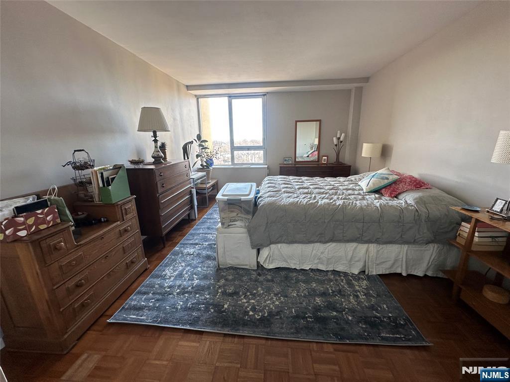 1 Horizon Road, Unit 1025 Fort Lee, NJ 07024 - Photo 15 of 27 a bed room with a bed and a couch