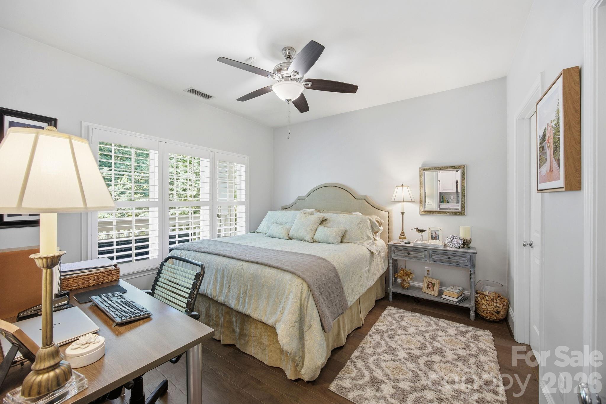 8942 Rosalyn Glen Road Cornelius, NC 28031 - Photo 25 of 47 a bedroom with a bed and a window