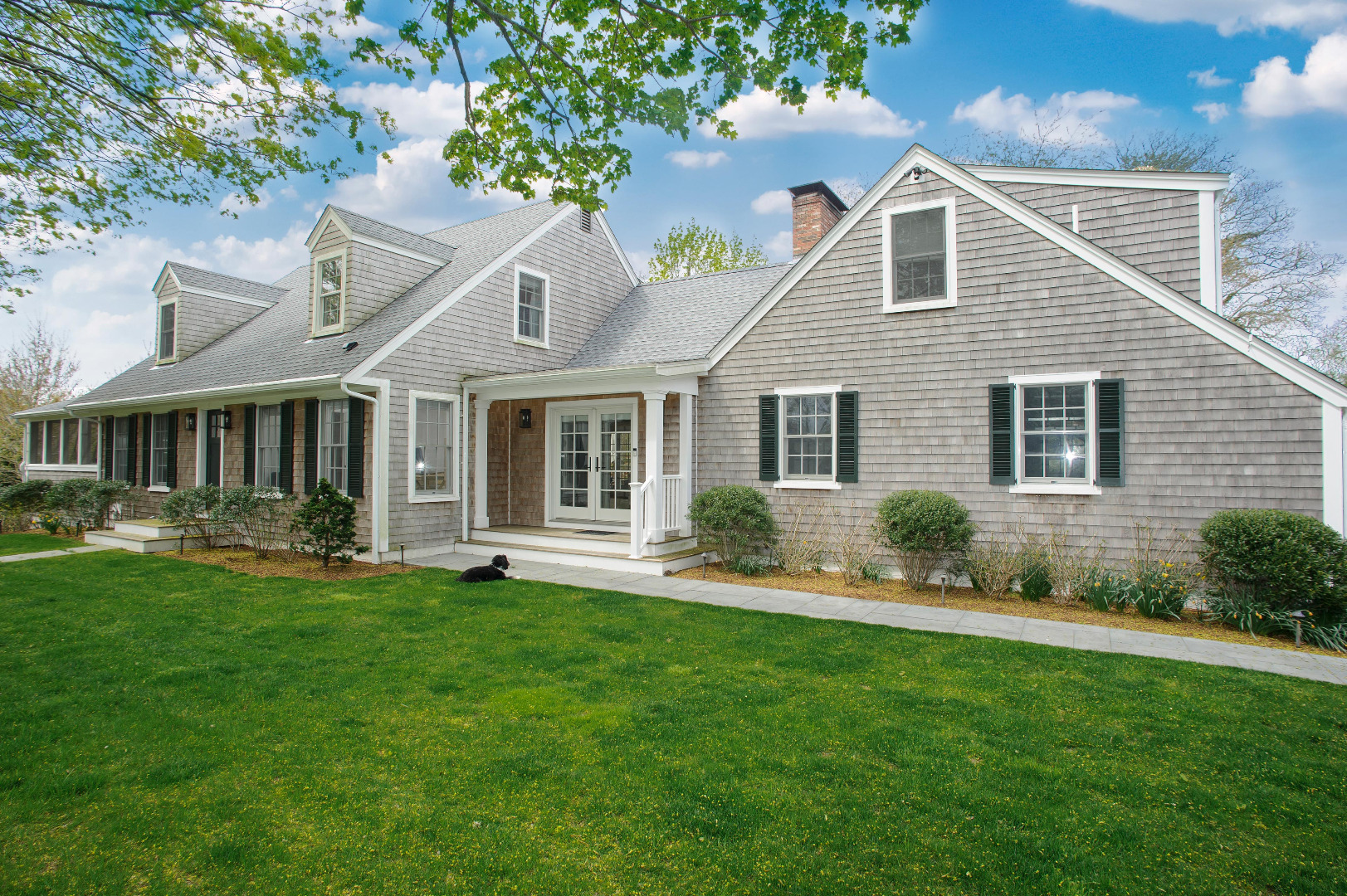 31 North Street Edgartown, MA 02539 - Photo 2 of 49 a front view of a house with a yard and porch