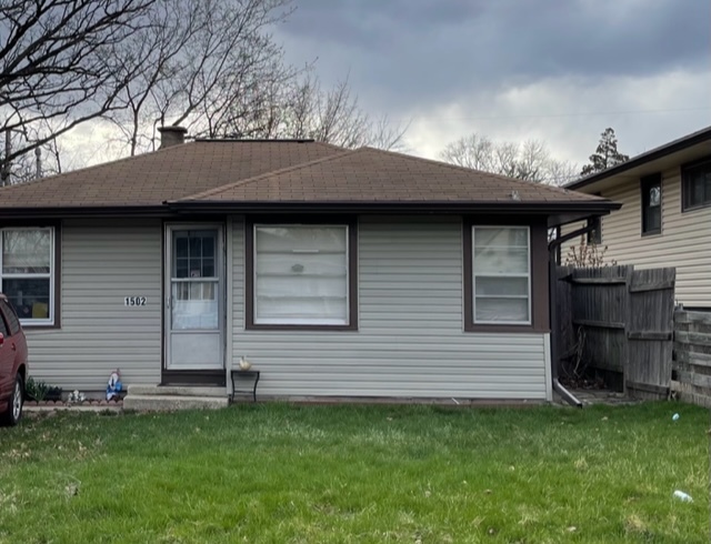 1502 Ridgeway Street Round Lake Beach, IL 60073 - Photo 11 of 11 a backyard of a house with barbeque oven
