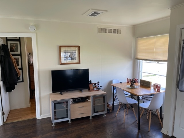 1502 Ridgeway Street Round Lake Beach, IL 60073 - Photo 3 of 11 a living room with furniture and a flat screen tv