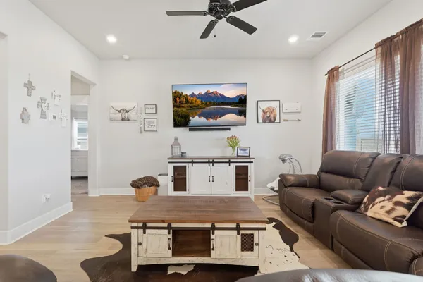 a living room with furniture and window