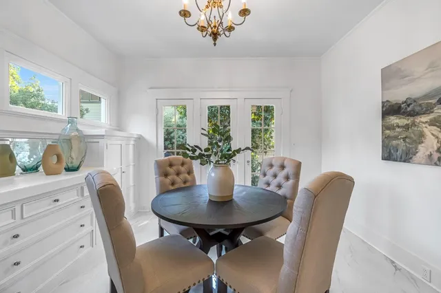 a spacious bathroom with a granite countertop sink mirror and a bathtub