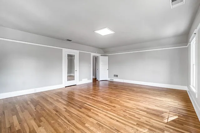 a view of a backyard with swimming pool