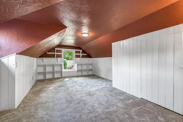 a view of a fountain in a yard with palm trees