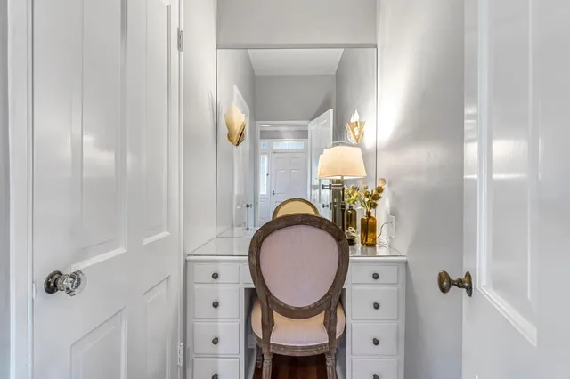 a living room with fireplace furniture and a wooden floor