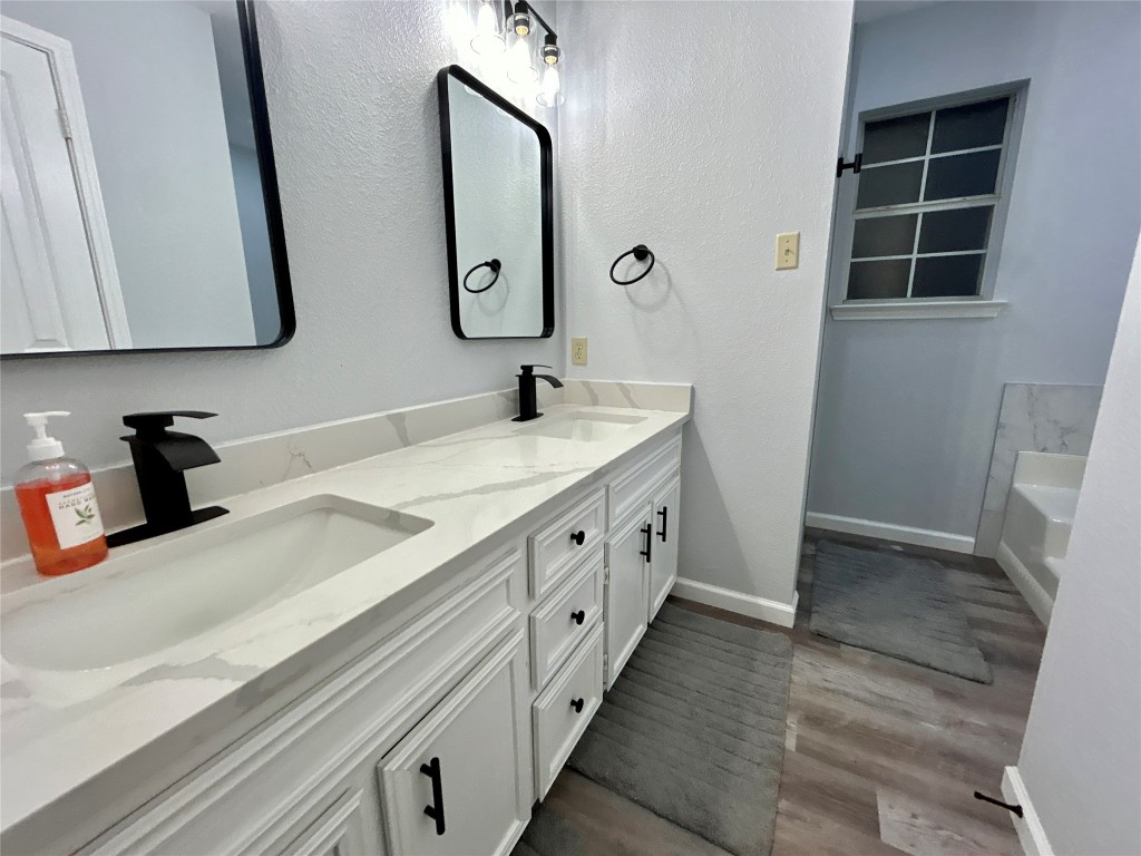 1701 Lynx Circle Harker Heights, TX 76548 - Photo 16 of 17 a spacious bathroom with double vanity and a mirror