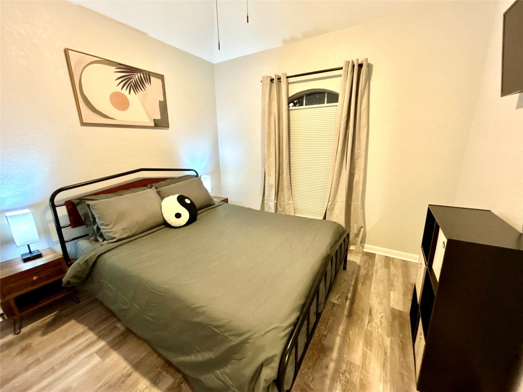 1701 Lynx Circle Harker Heights, TX 76548 - Photo 8 of 17 a bedroom with a bed and wooden floor