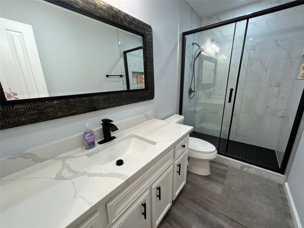 1701 Lynx Circle Harker Heights, TX 76548 - Photo 9 of 17 a bathroom with a sink a toilet and mirror