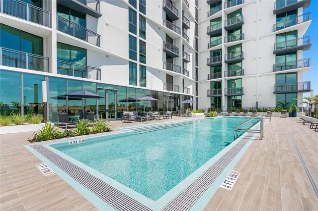 a view of a lobby with furniture and floor to ceiling window