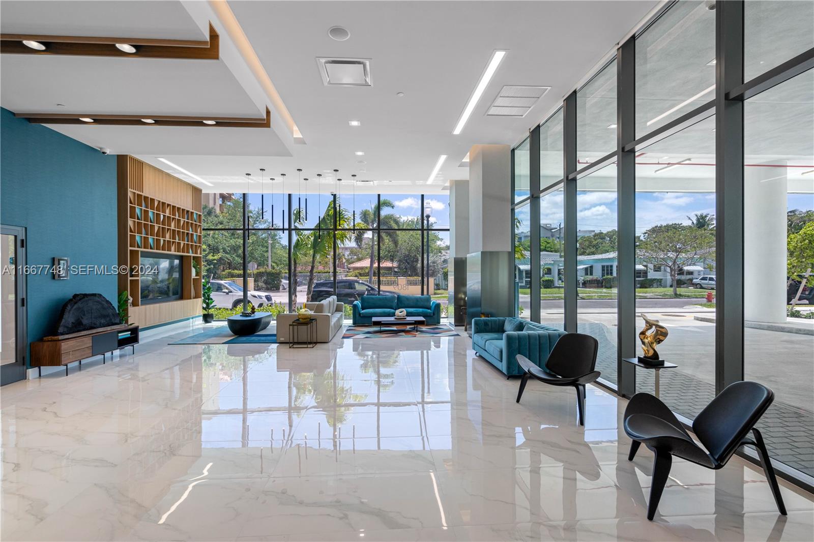 1809 Jackson Street, Unit 1002 Hollywood, FL 33020 - Photo 24 of 46 a view of a lobby with furniture and floor to ceiling window