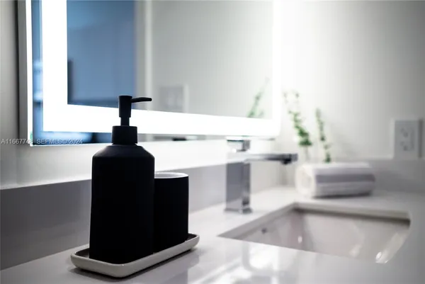 a kitchen with stainless steel appliances a stove a microwave and cabinets