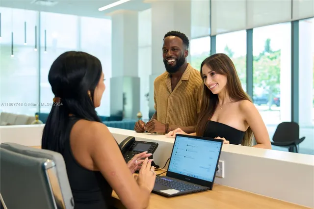 a living room with furniture and a mirror
