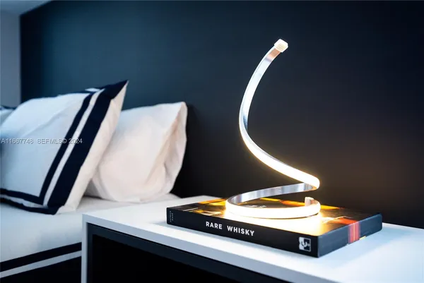 a kitchen with a sink and a mirror