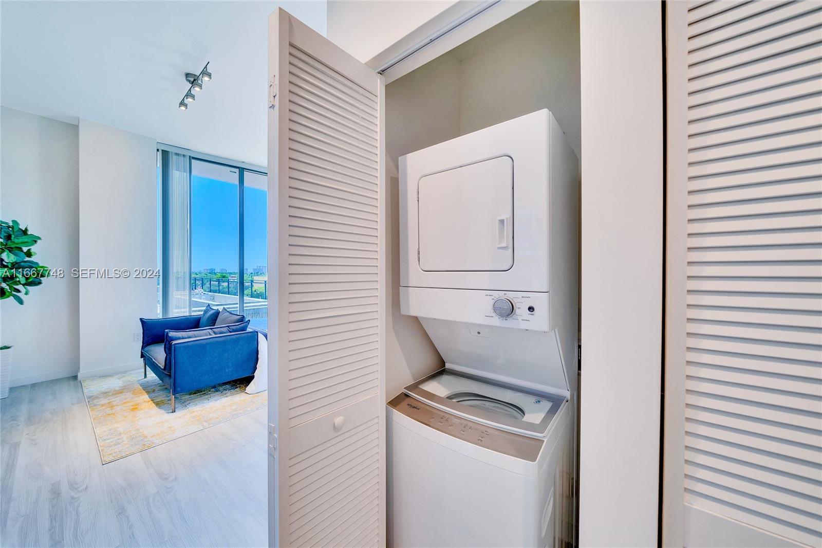 1809 Jackson Street, Unit 1002 Hollywood, FL 33020 - Photo 38 of 46 a room with furniture and potted plant