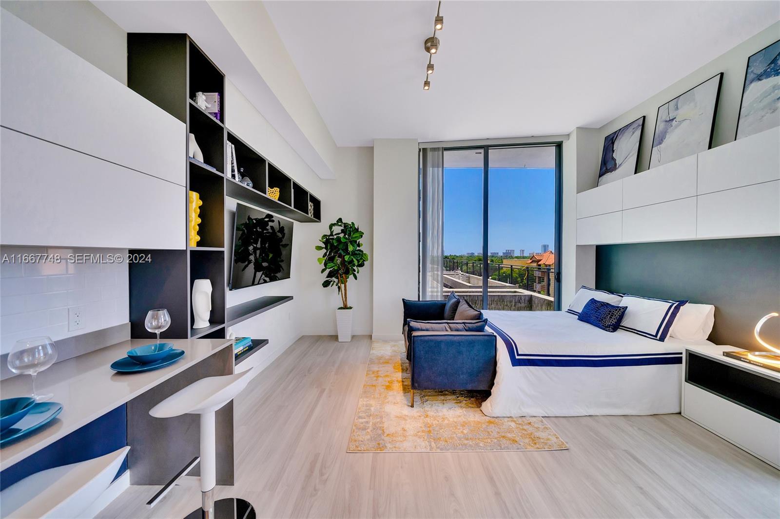 1809 Jackson Street, Unit 1002 Hollywood, FL 33020 - Photo 39 of 46 a living room with furniture and a fireplace