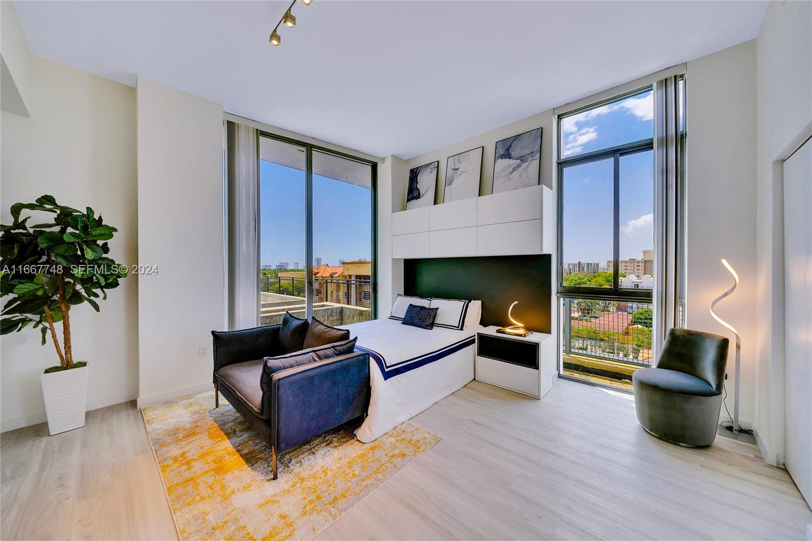 1809 Jackson Street, Unit 1002 Hollywood, FL 33020 - Photo 41 of 46 a living room with furniture fireplace and potted plant