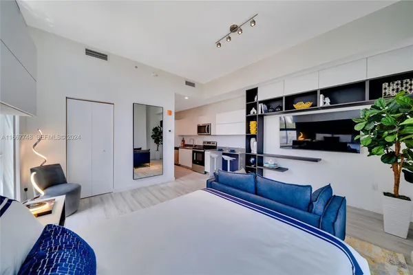 a bed room with a bed and a desk