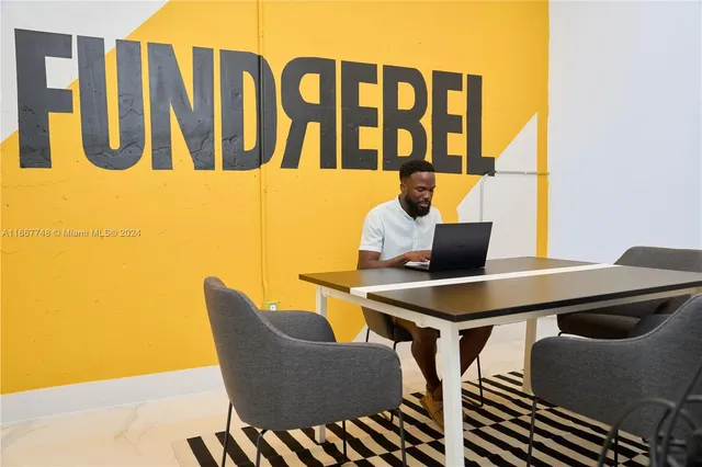 a workspace with furniture and rug