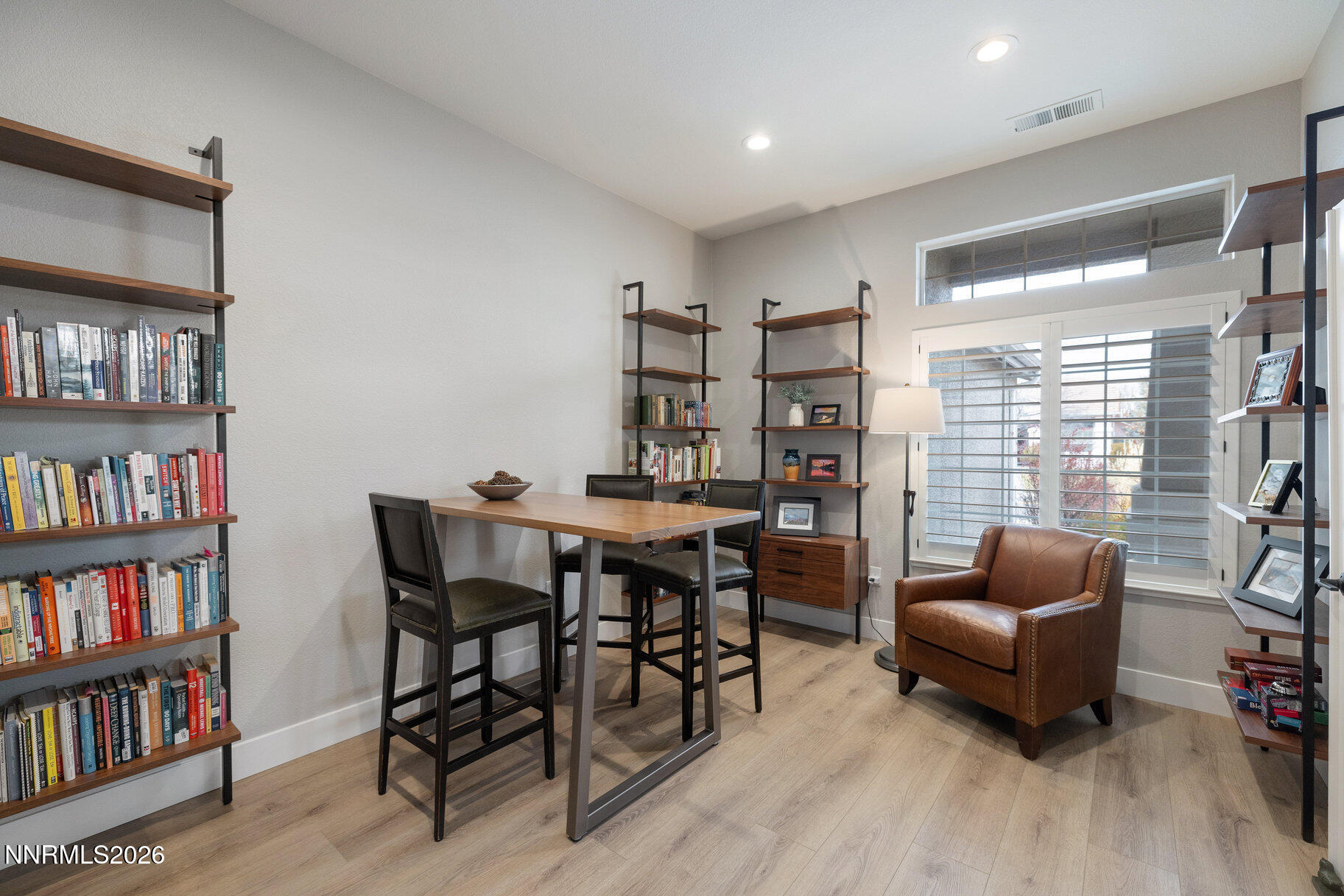 1290 El Monte Court Reno, NV 89521 - Photo 12 of 37 a livingroom with furniture and a book shelf