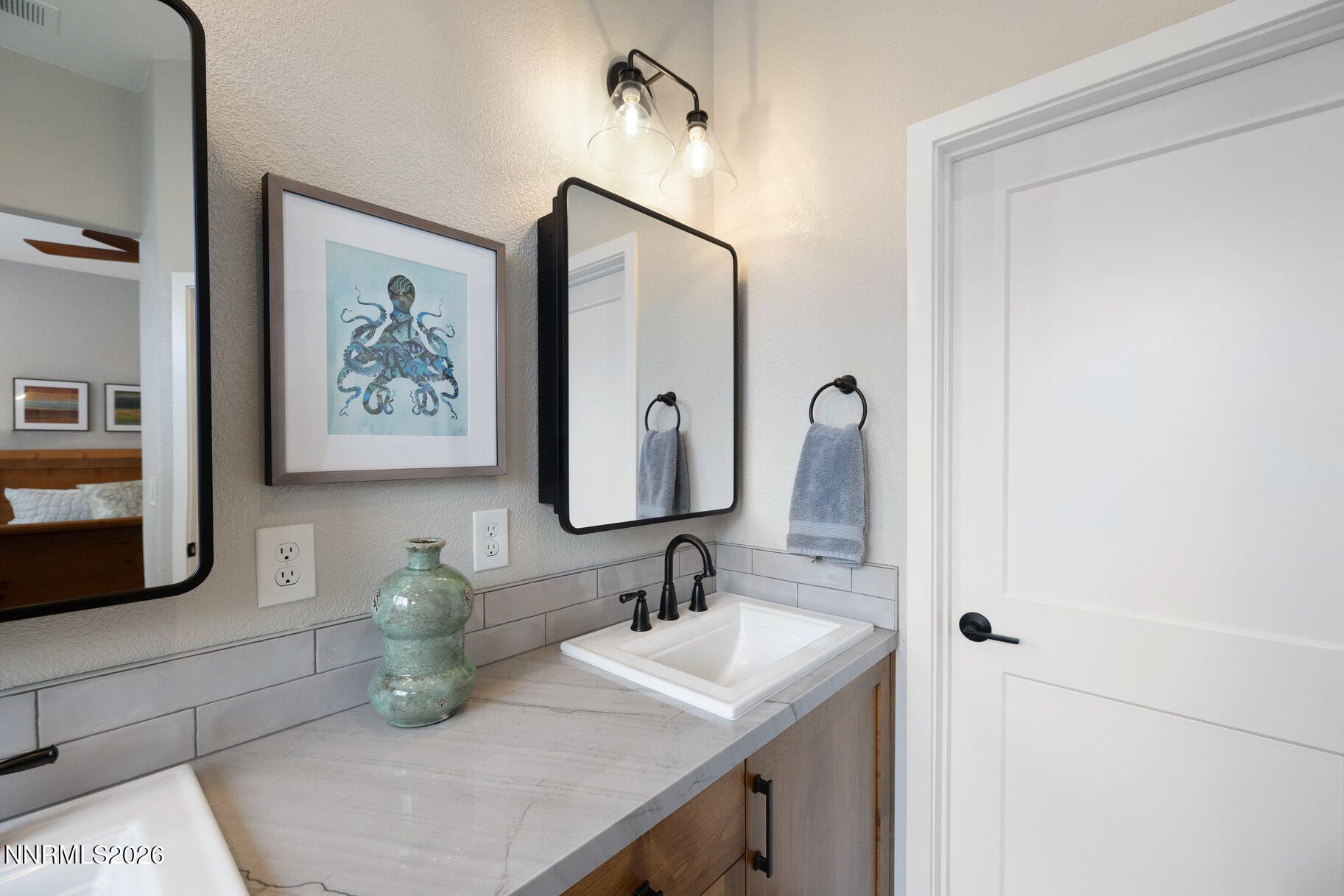 1290 El Monte Court Reno, NV 89521 - Photo 19 of 37 a bathroom with a sink and a mirror