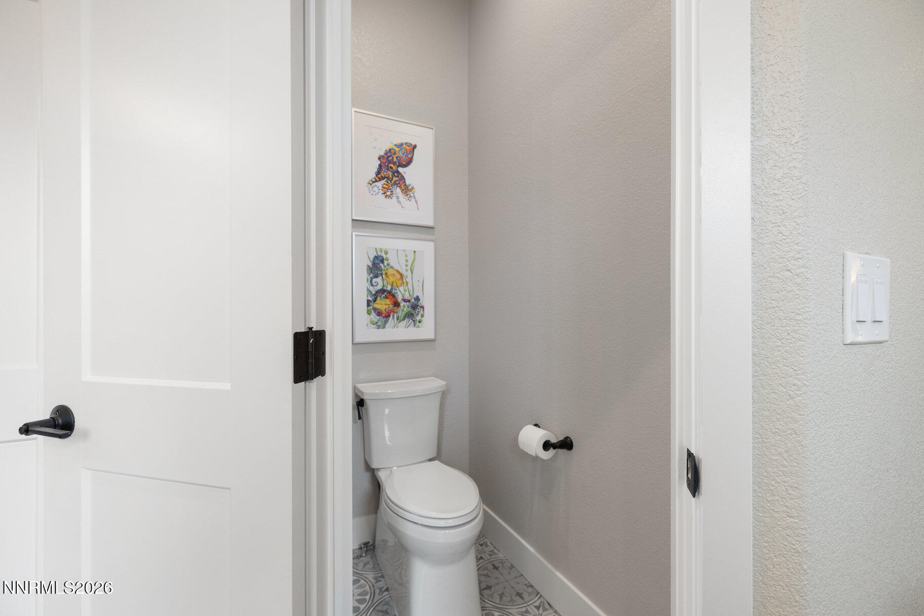 1290 El Monte Court Reno, NV 89521 - Photo 21 of 37 a white toilet sitting next to a bathroom sink