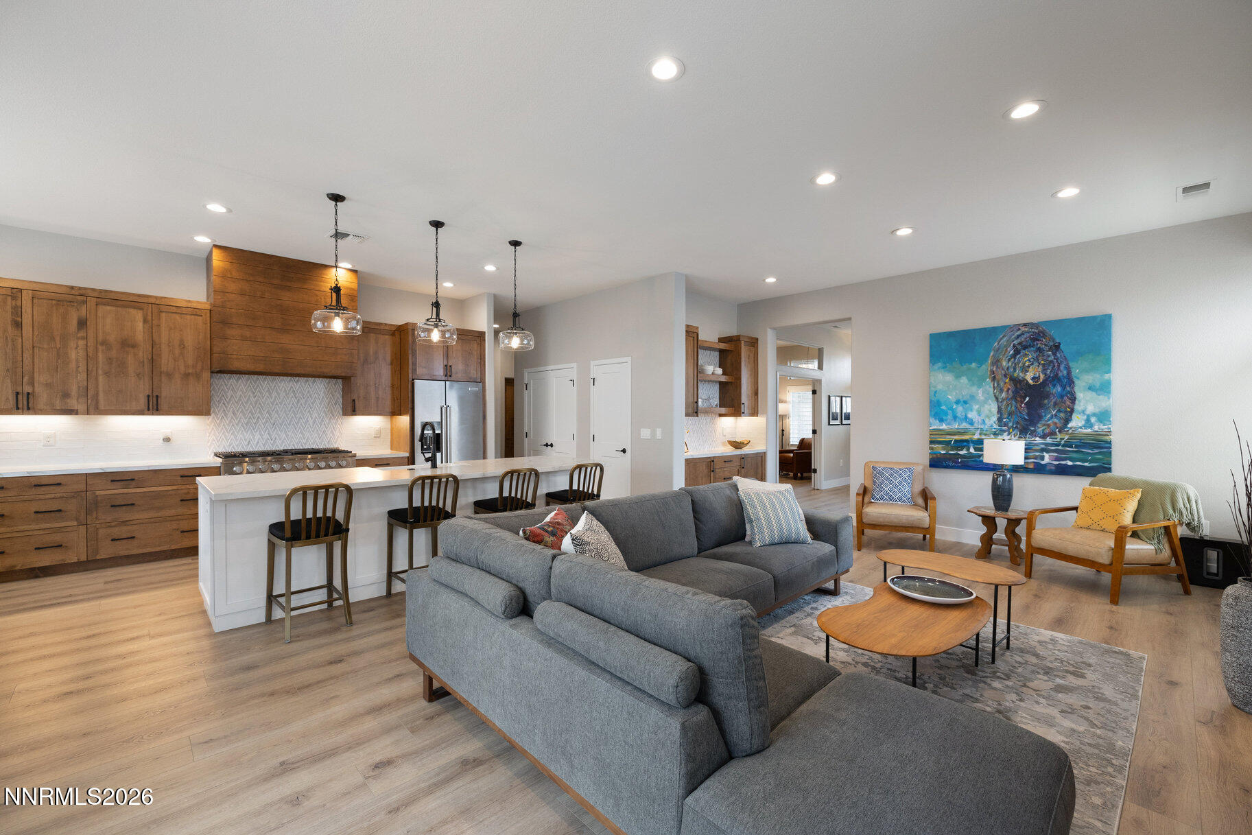 1290 El Monte Court Reno, NV 89521 - Photo 27 of 37 a living room with furniture kitchen view and a wooden floor