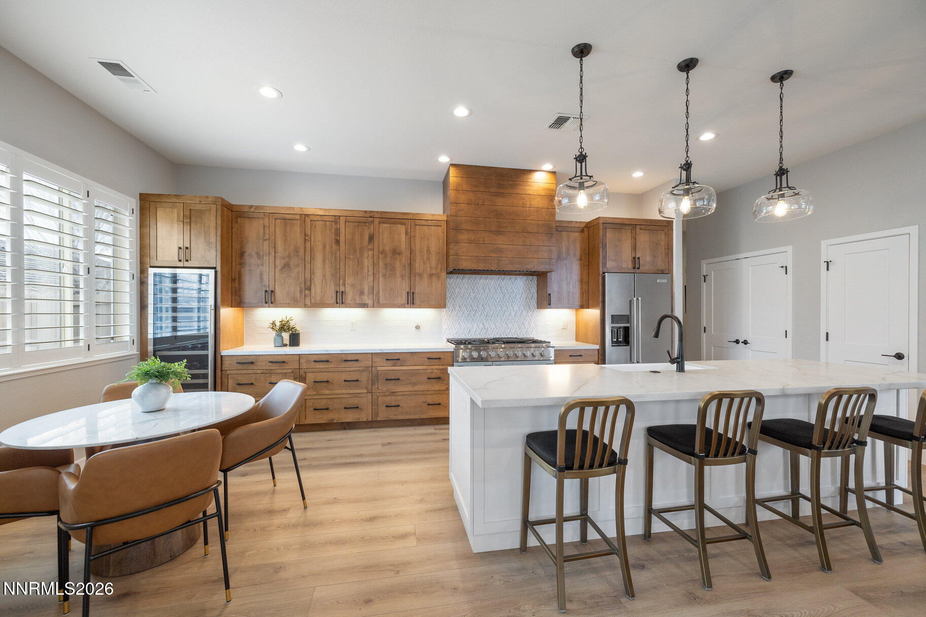 1290 El Monte Court Reno, NV 89521 - Photo 28 of 37 a large kitchen with a table and chairs