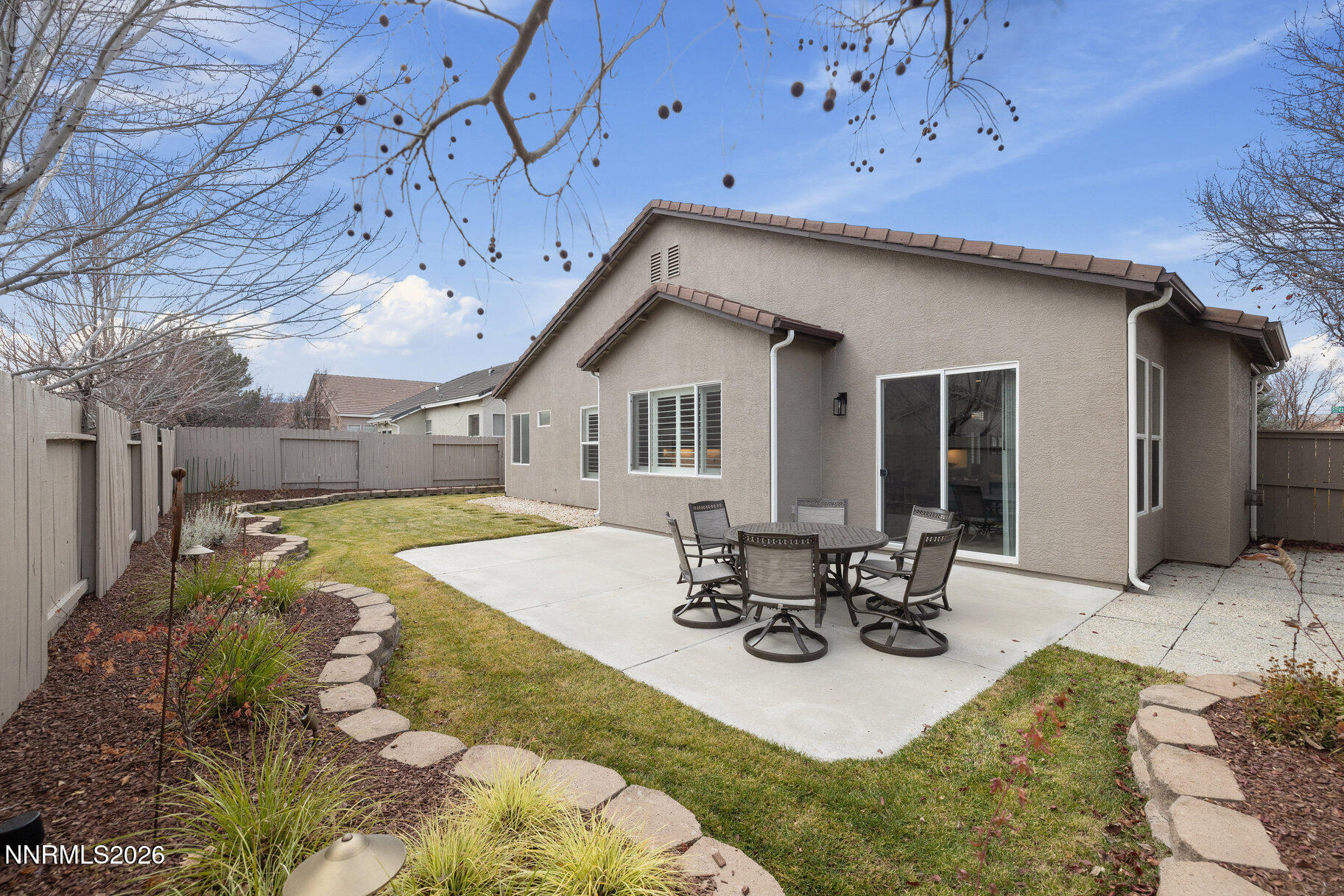 1290 El Monte Court Reno, NV 89521 - Photo 32 of 37 a view of a patio with table and chairs and potted plants