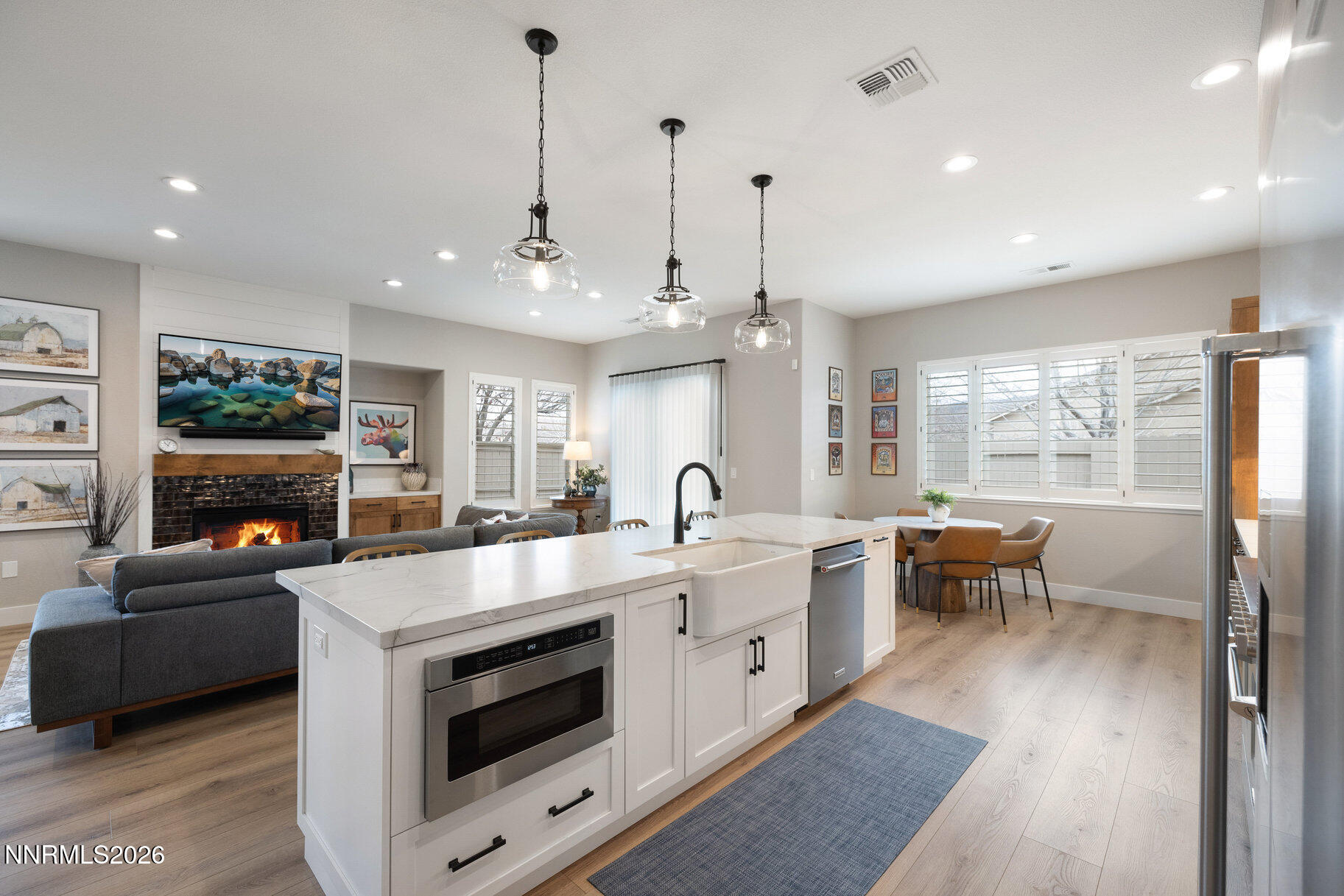 1290 El Monte Court Reno, NV 89521 - Photo 8 of 37 a large kitchen with kitchen island a large counter space a sink stainless steel appliances and cabinets