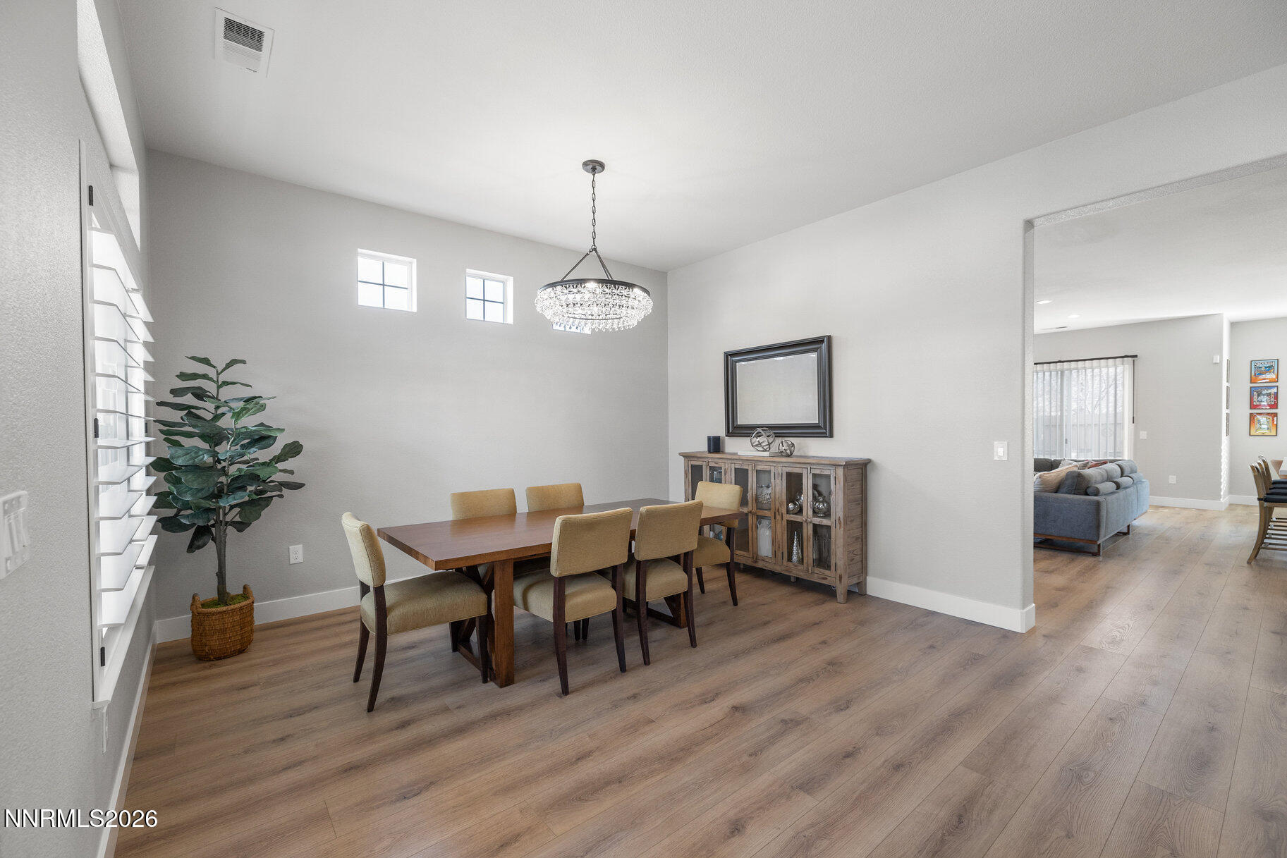 1290 El Monte Court Reno, NV 89521 - Photo 9 of 37 a view of a dining room with furniture and wooden floor