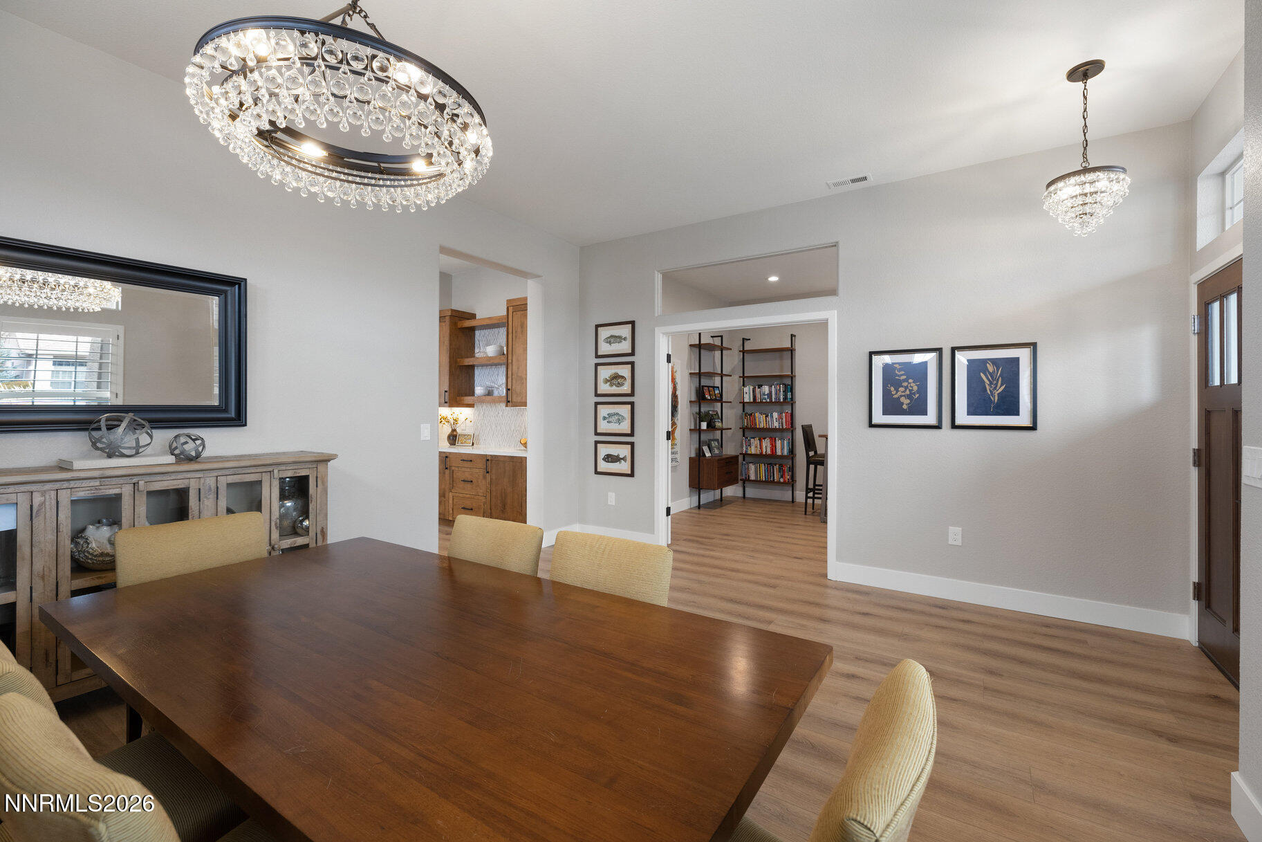 1290 El Monte Court Reno, NV 89521 - Photo 10 of 37 a view of a dining room with furniture and wooden floor