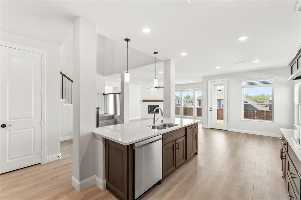 4213 Bel Air Drive Midlothian, TX 76065 - Photo 16 of 40 an open kitchen with a sink and dish washer