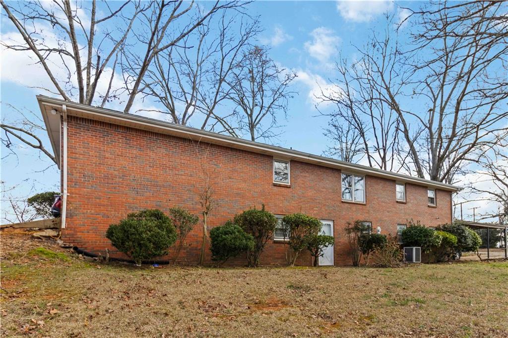 3829 Reynolds Road Douglasville, GA 30135 - Photo 19 of 24 a view of a house with a yard