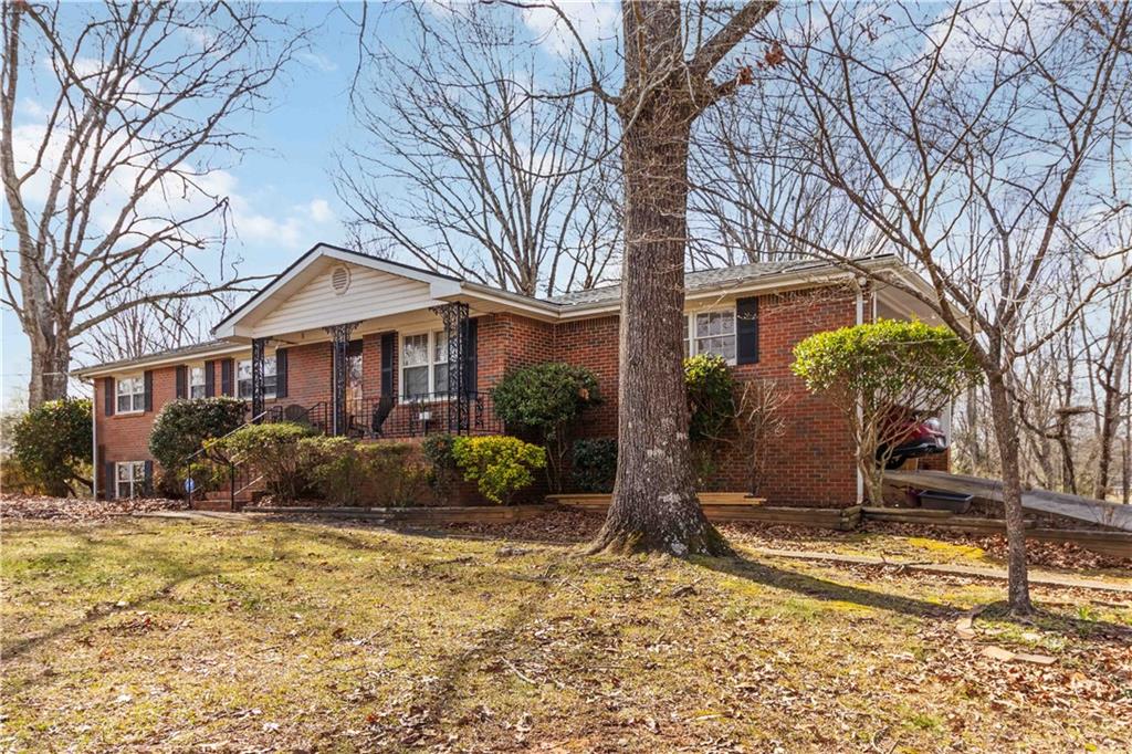 3829 Reynolds Road Douglasville, GA 30135 - Photo 2 of 24 front view of a house with a yard