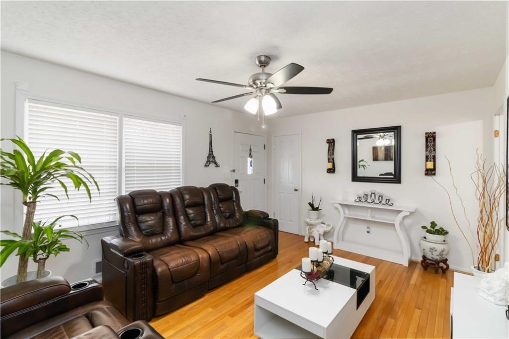 3829 Reynolds Road Douglasville, GA 30135 - Photo 5 of 24 a living room with furniture fireplace and a potted plant
