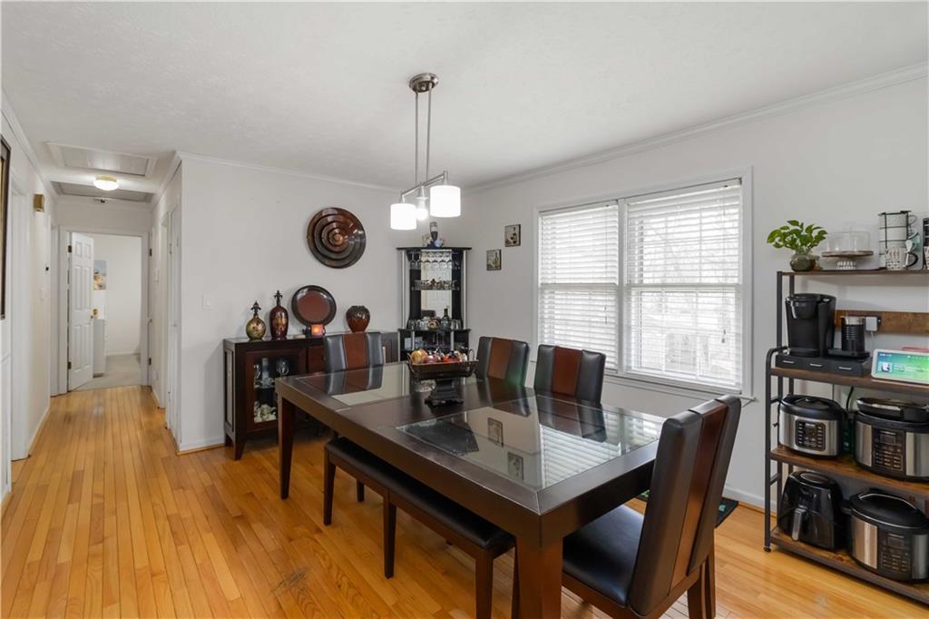 3829 Reynolds Road Douglasville, GA 30135 - Photo 7 of 24 a view of a dining room with furniture window and wooden floor