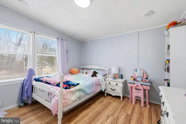 a bed room with a bed and a window