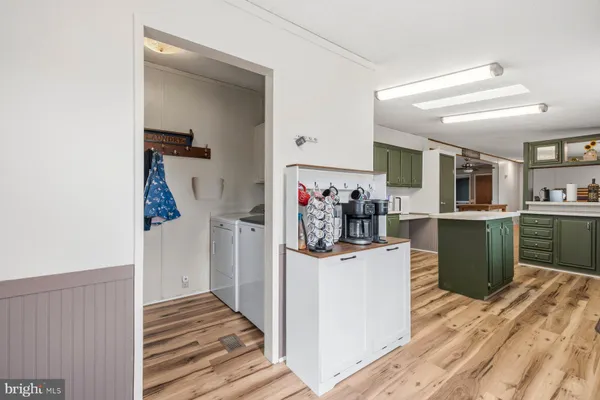 a kitchen with a refrigerator and a sink